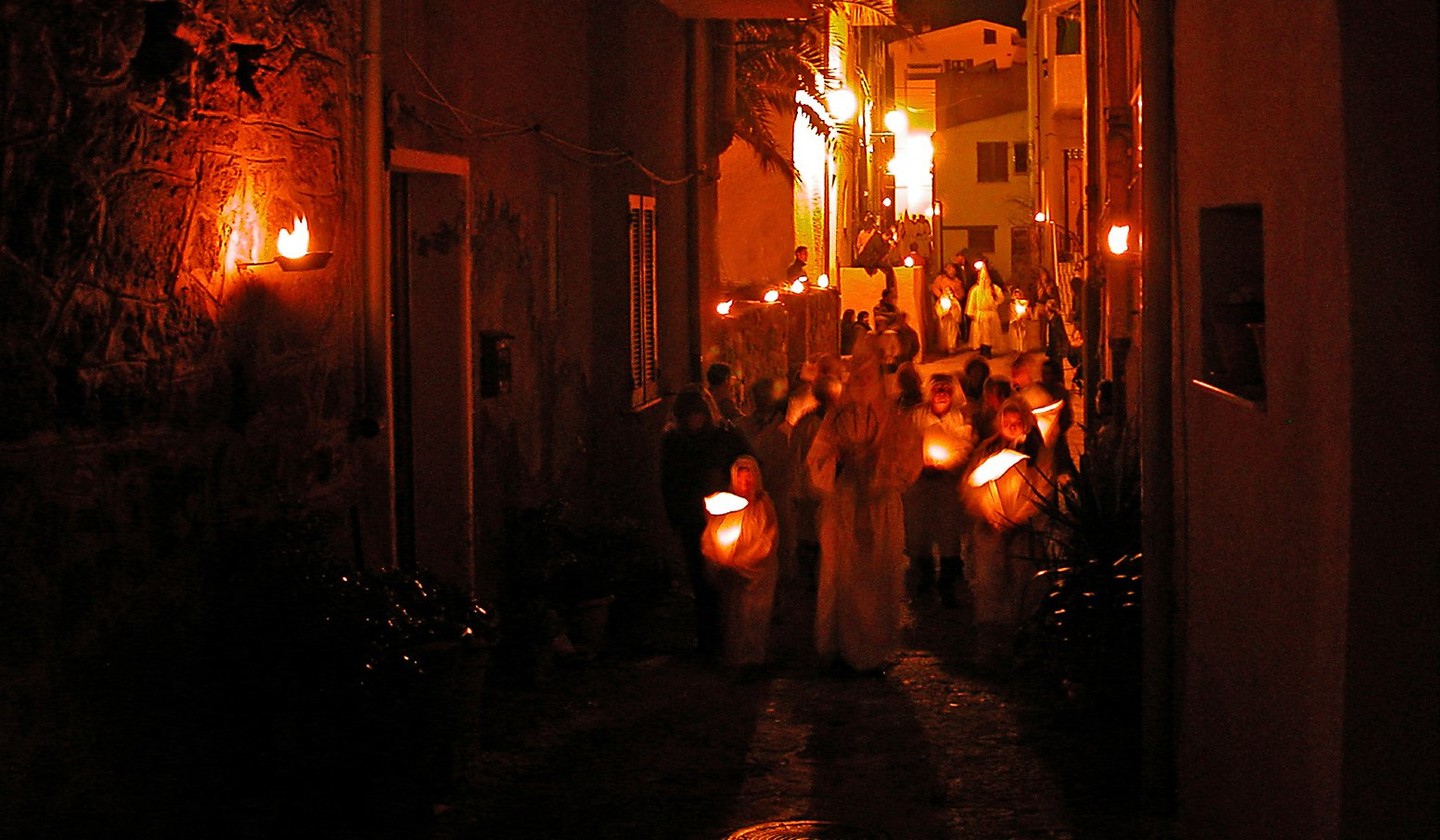 Sardinia private tours: Experience Lunissanti capturing its torchlit procession and sacred chants
