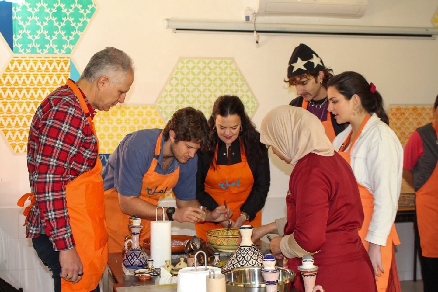Savor Marrakesh's flavors in a heartwarming 3-hour cooking experience at Amal Center.