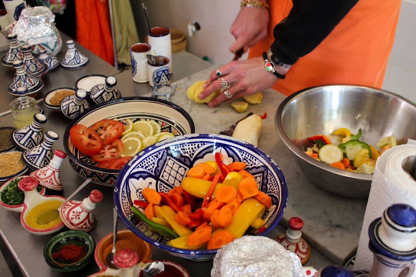 Savor Marrakesh's flavors in a heartwarming 3-hour cooking experience at Amal Center.