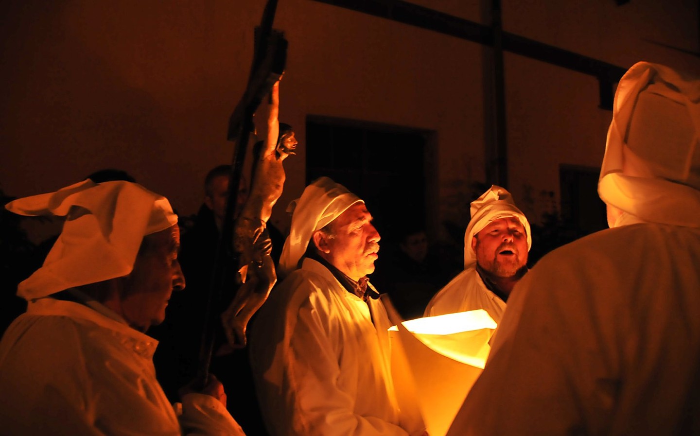 Sardinia private tours: Experience Lunissanti capturing its torchlit procession and sacred chants